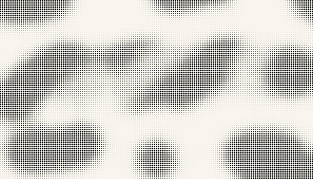 Halftone black grunge dots on white background