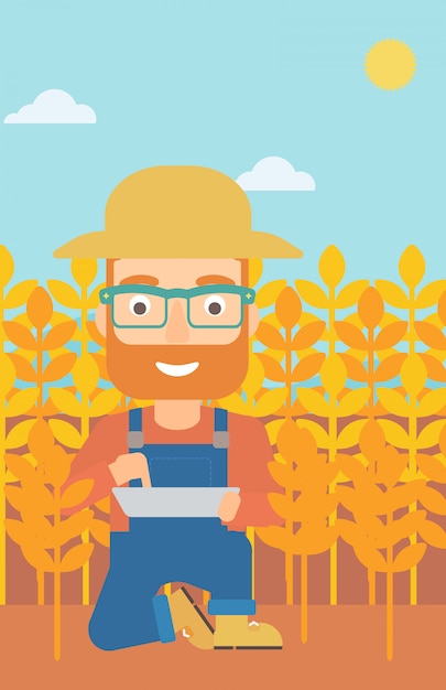 man with tablet computer on field