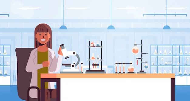 scientist using microscope and test tubes woman in uniform sitting at table