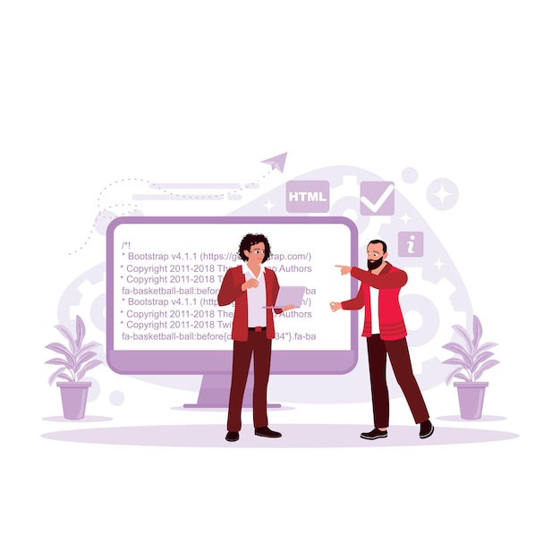 Smiling bearded man pointing at a computer monitor while explaining web code to colleagues
