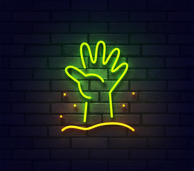 Zombie hand neon sign. Glowing neon light signboard  on brick wall.
