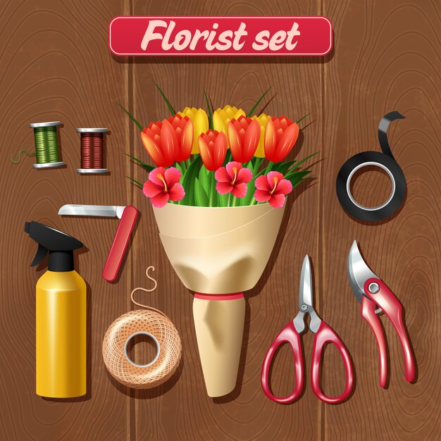 Accesorios de floristería con realista ramo de flores sobre fondo de madera