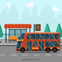 Vector gratuito autobús urbano y parada de autobús con diseño plano
