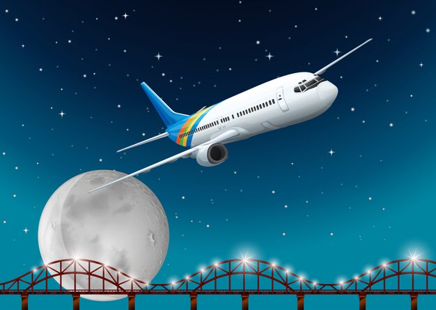 Avión volando sobre el puente en la noche