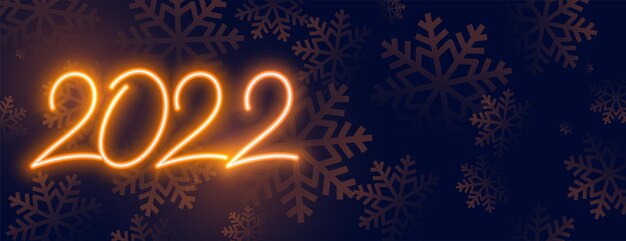 Banner de año nuevo de neón dorado 2022 con copos de nieve