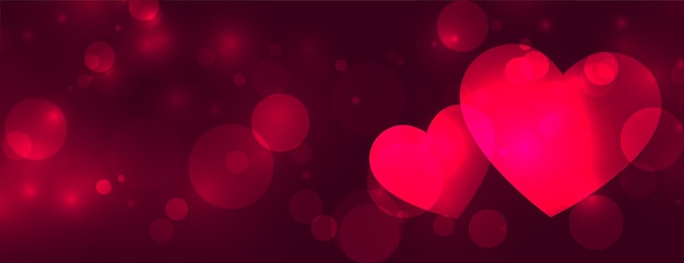 Banner de bokeh de dos corazones de amor brillante
