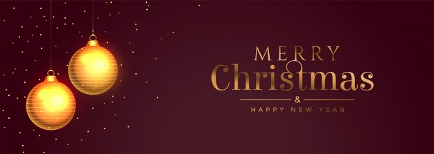 Banner de feliz navidad con balón de oro y destellos