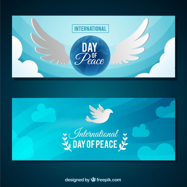 Banner de paz con palomas y alas en diseño plano