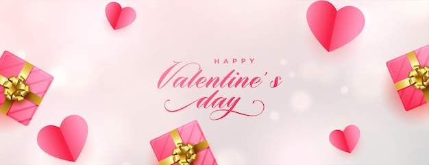 Banner romántico del día de san valentín con corazones de papel y cajas de regalo rosa