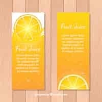 Vector gratuito banners decorativos con zumo de naranja