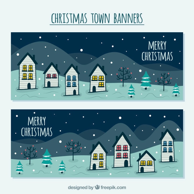 Banners de feliz navidad con casas dibujadas a mano