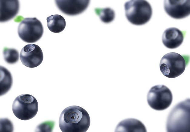 Blueberries frescos y maduros con hojas verdes en el marco
