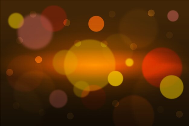 Bokeh efecto de luces doradas sobre fondo oscuro