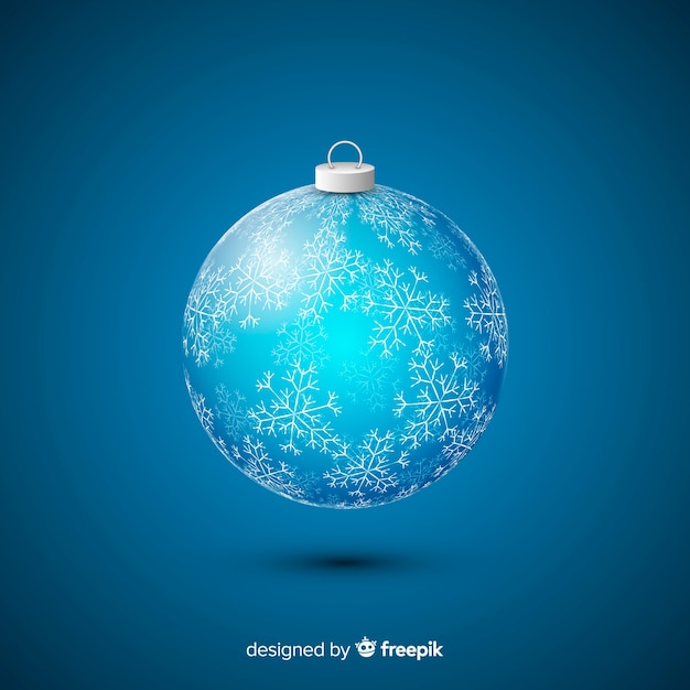 Vector gratuito bola de navidad de cristal sobre fondo azul.