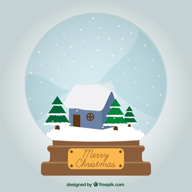 Bola de nieve de Navidad con paisaje invernal
