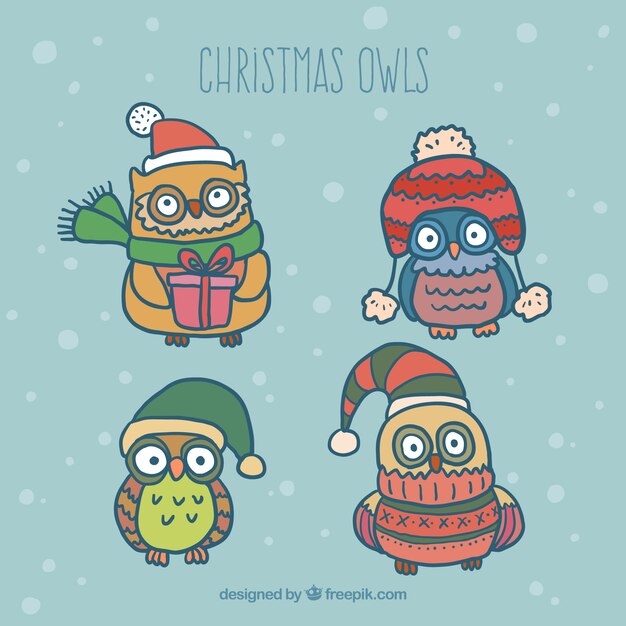 Búhos lindos de navidad dibujados a mano