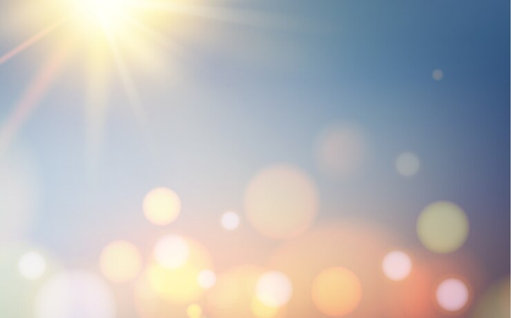 Vector gratuito burbujas de bokeh y destello del sol sobre un fondo azul