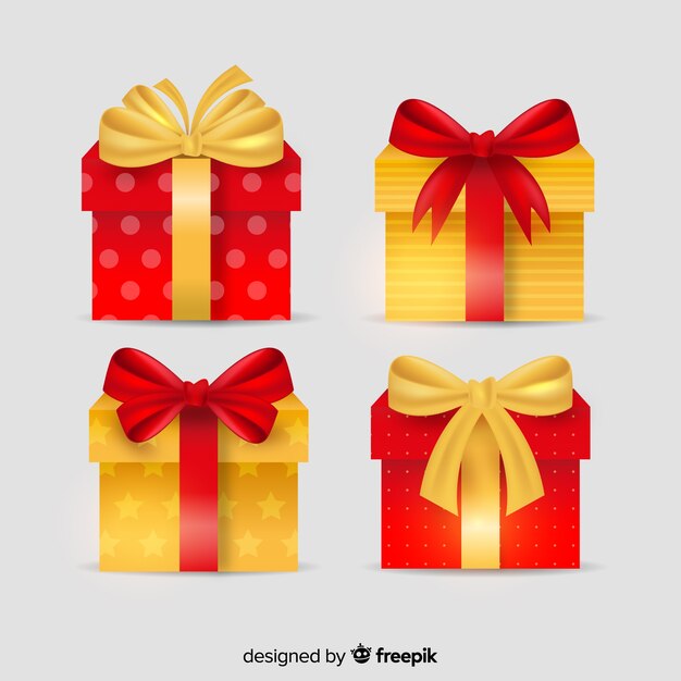 Cajas de regalo doradas y rojas con cinta