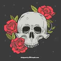 Vector gratuito calavera fantástica con flores rojas dibujadas a mano