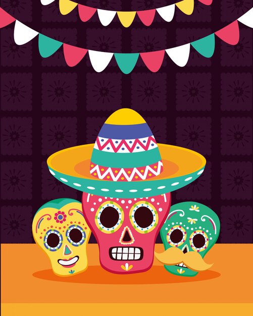 Calaveras mexicanas con sombrero y guirnaldas