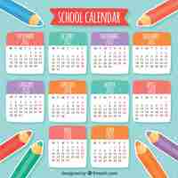 Vector gratuito calendario escolar con lápices de colores