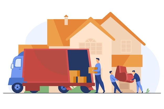 Cargadores llevando sillón y cajas en casa nueva