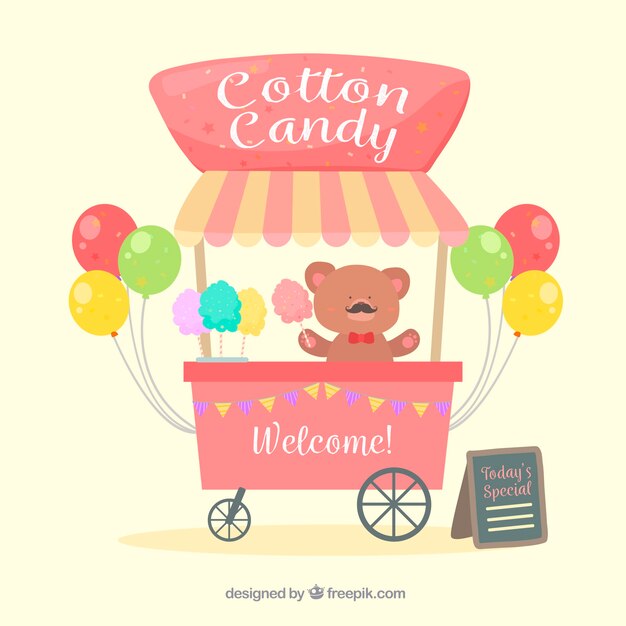 Carro de algodón de azúcar, oso de peluche y globos