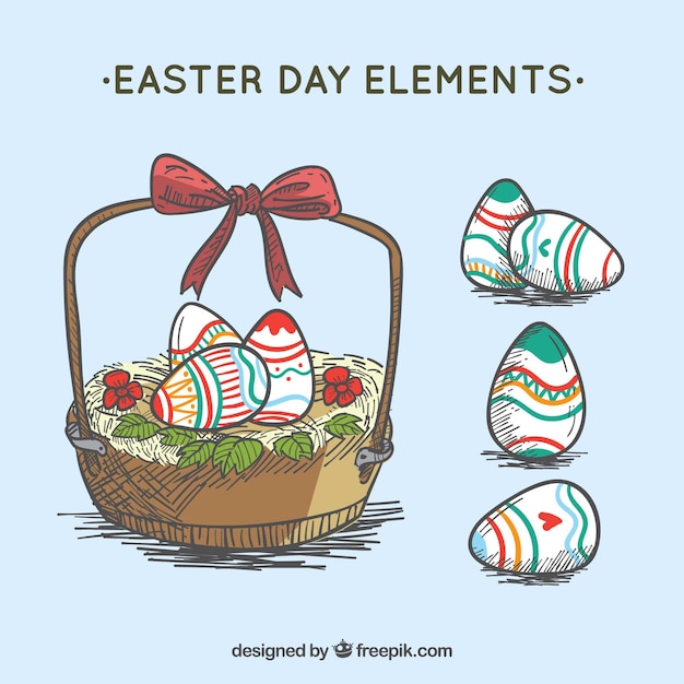 Vector gratuito cesta y huevos de pascua dibujados a mano