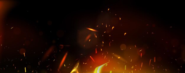 Las chispas de fuego brillantes se elevan sobre un fondo oscuro.