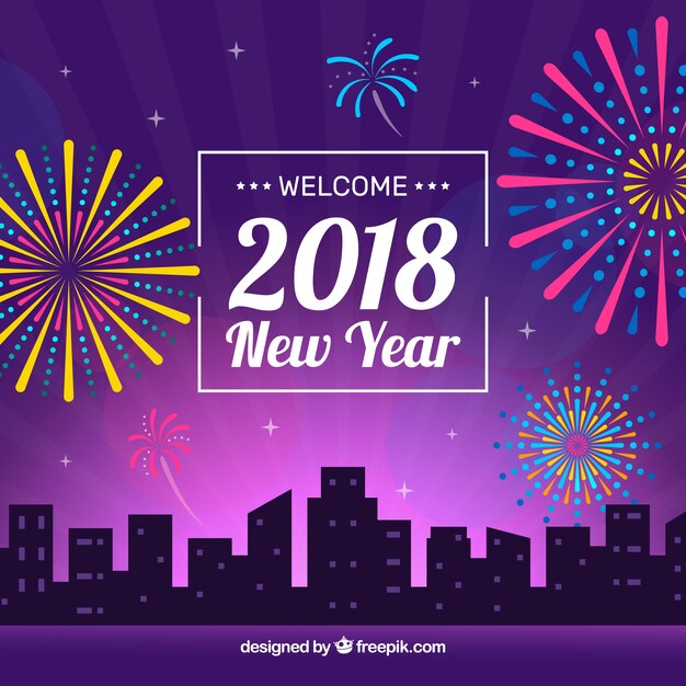 Una ciudad por la noche y los fuegos artificiales