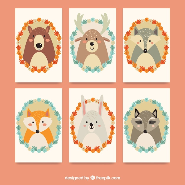 Colección de tarjetas con animales y marcos florales