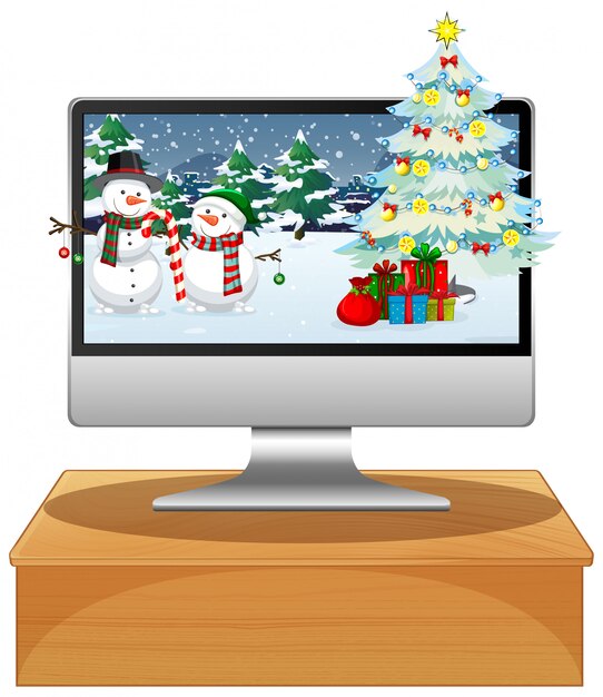 Computadora sobre la mesa con fondo de escritorio de Navidad
