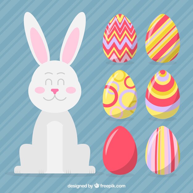 Vector gratuito conejo de pascua con huevos