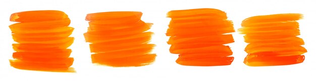 Conjunto de cuatro trazos de pincel acuarela naranja