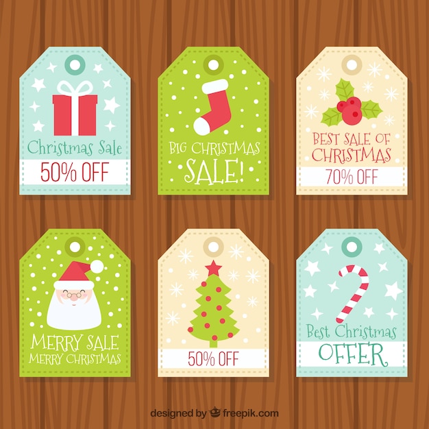 Vector gratuito conjunto de etiquetas de descuentos con bonitos dibujos navideños