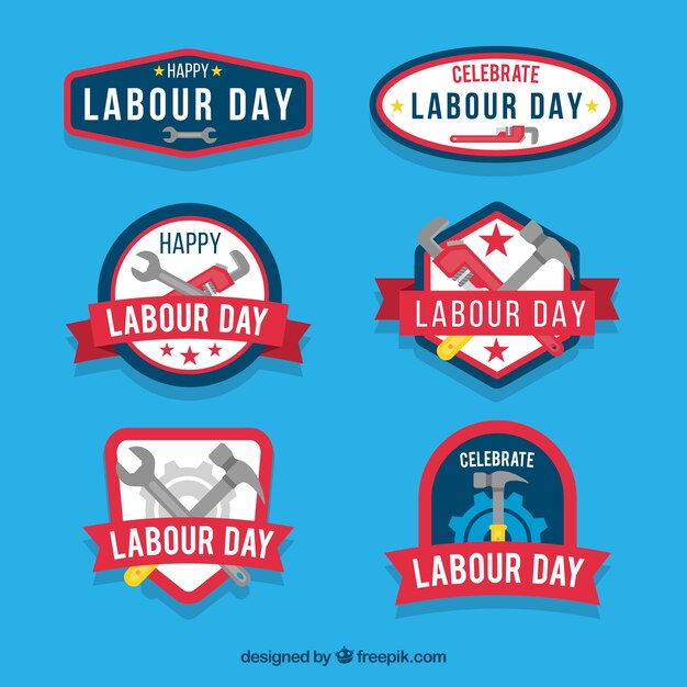 Conjunto de insignias del día laboral con herramientas en estilo plano