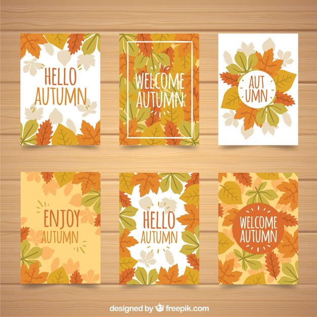 Conjunto moderno de tarjetas con hojas otoñales