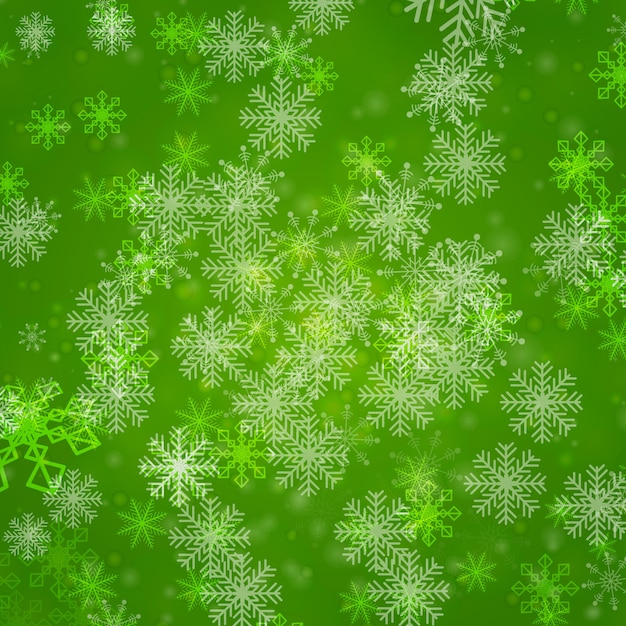 Copos de nieve sobre fondo verde