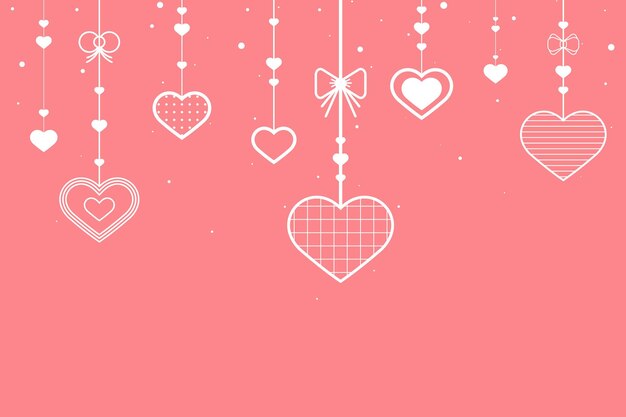 Corazones colgantes sobre fondo rosa