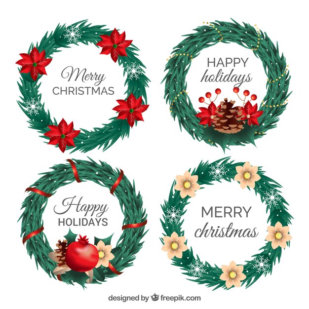 Coronas navideñas con flores rojas y blancas y cintas