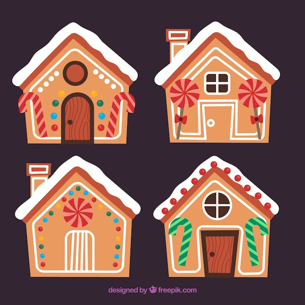 Vector gratuito cuatro casitas de jengibre decoradas con piruletas