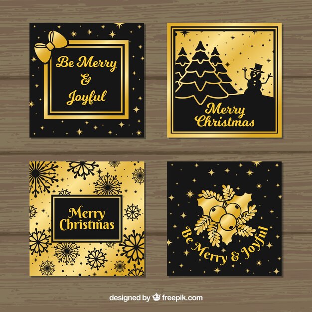 Cuatro tarjetas cuadradas de color negro y dorado