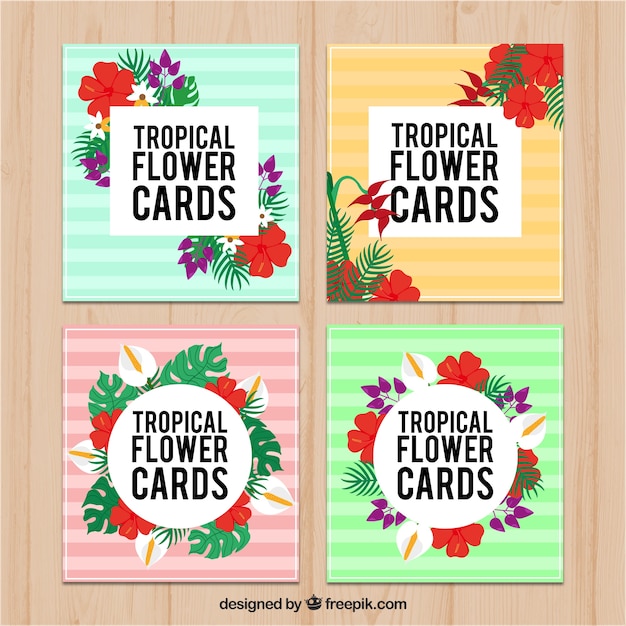 Vector gratuito cuatro tarjetas tropicales de rayas de colores con flores