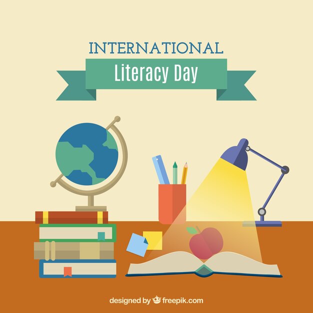 Día de la alfabetización con un libro abierto y otros artículos