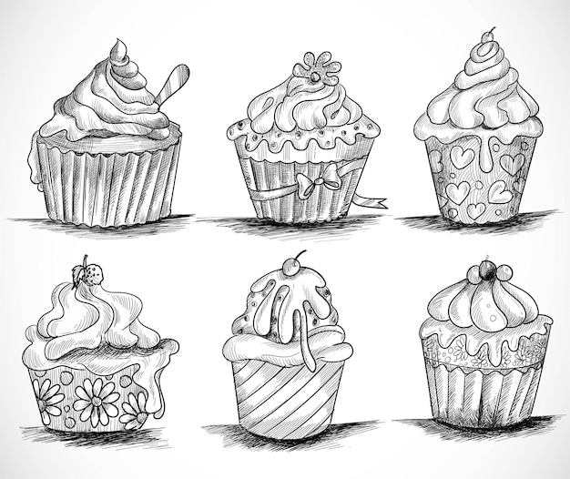 Dibujar a mano cup cakes decorativos set diseño de boceto