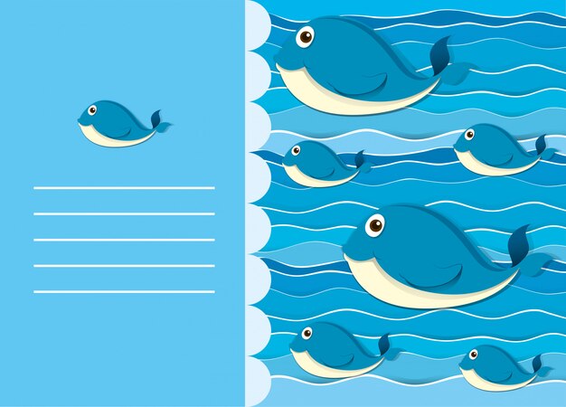 Diseño de papel con ballena en agua.