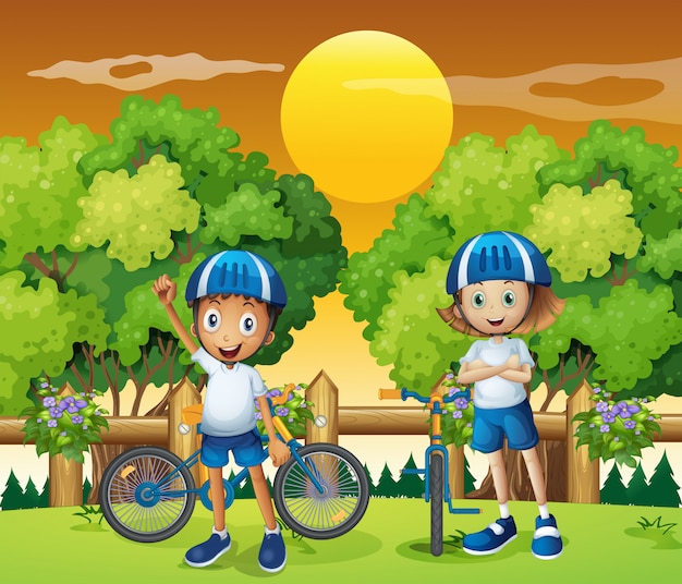 Dos adorables niños en bicicleta