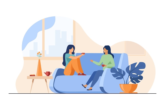 Dos amigas reunidas y charlando en casa
