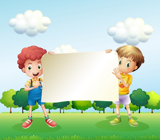 Dos niños sosteniendo un letrero vacío