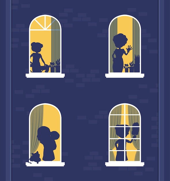 Edificio de ventanas nocturnas con siluetas de personas.